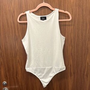 Vici Cream Sleeveless Thong Bodysuit Never Worn. Size medium